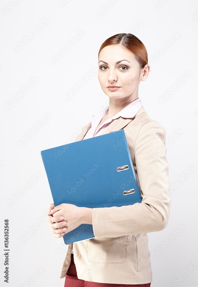 Young business woman with a blue folder. Business, real estate. Young business woman with a blue folder. Business, real estate.