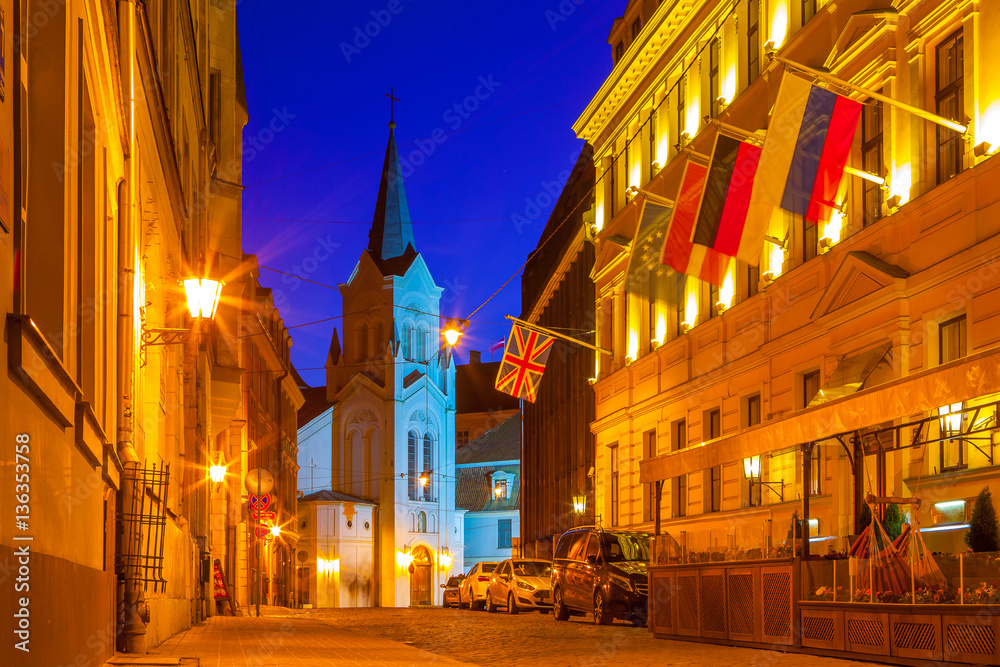 Bright night streets of old town. Riga, Latvia