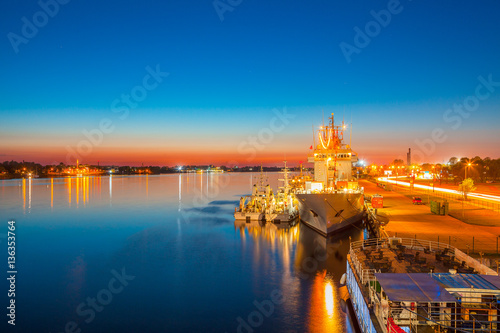 Night view of harbor and big ship near old town.