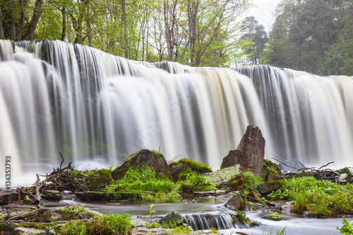 Keila Joa waterfall, long exposure and spring time with greenery. photo