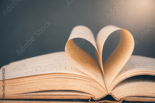 Opened book with heart shaped page.