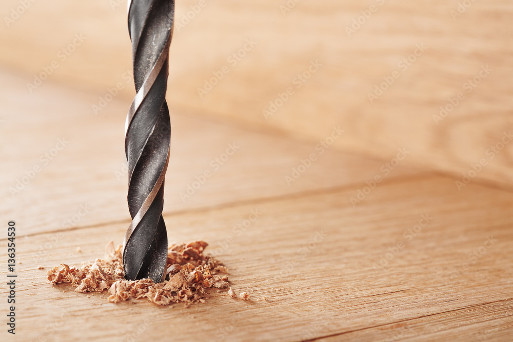 metal drill bit make holes in wooden oaks plank - obrazy, fototapety, plakaty 