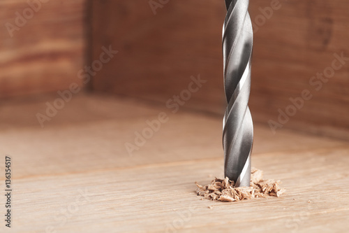 metal drill bit make holes in wooden oaks plank