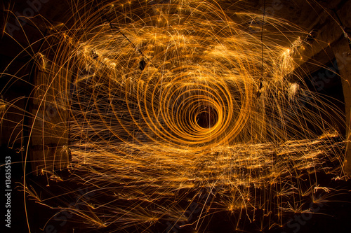 Freezelight using spinning burning steel wool and pyrotechnics 