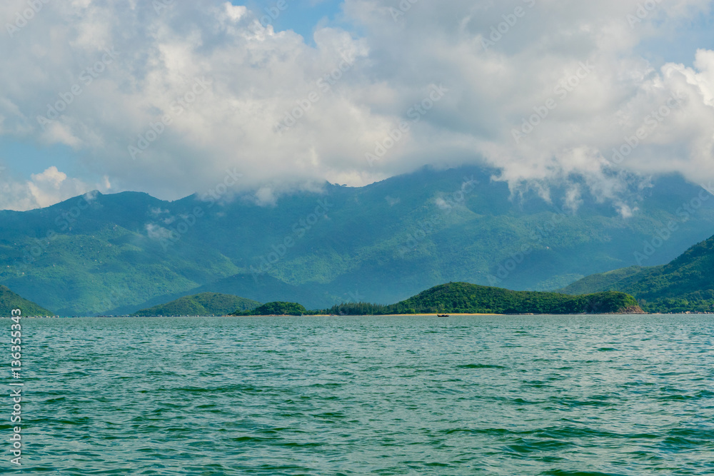 Sea landscape with island shore and clouds - the South China sea - Vietnam, Nha Trang bay