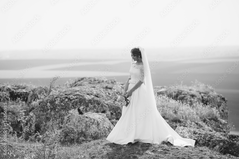 Naklejka premium Young bride walking in park.