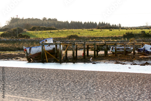 Boat beach scene culdaff photo