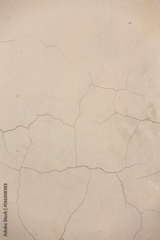 Fototapeta premium Texture beige cement wall with cracks
