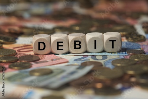 Obraz na plátně debit - cube with letters, money sector terms - sign with wooden cubes