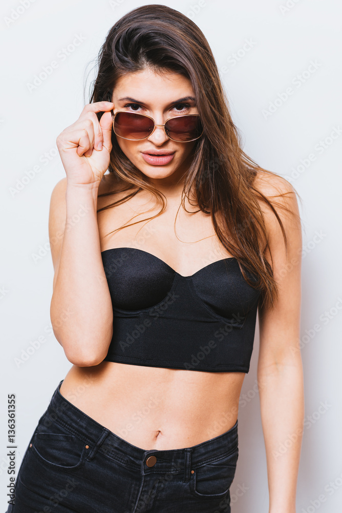 Portrait of a beautiful long hair woman with sunglasses-studio photo