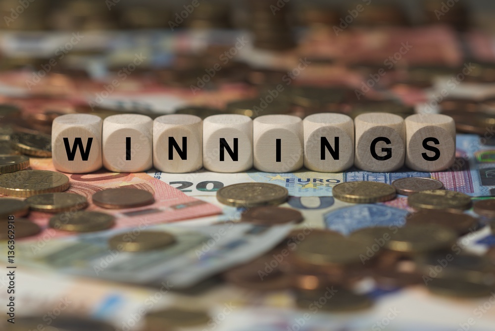 Φωτογραφία winnings - cube with letters, money sector terms - sign with wooden cubes