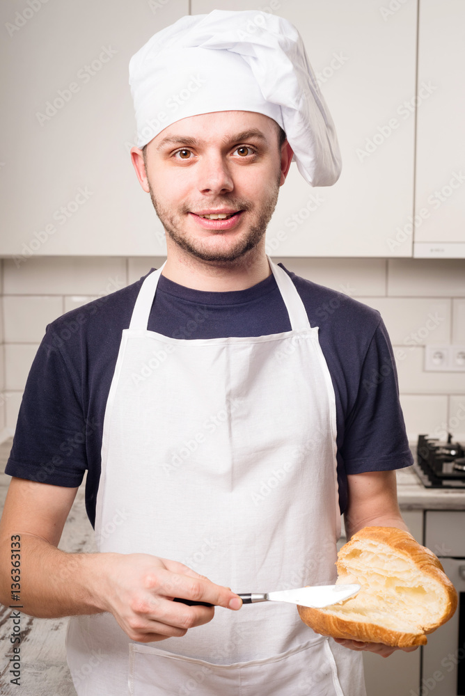slile baker with peanut butter on a slice of croissant slile baker with peanut butter on a slice of croissant