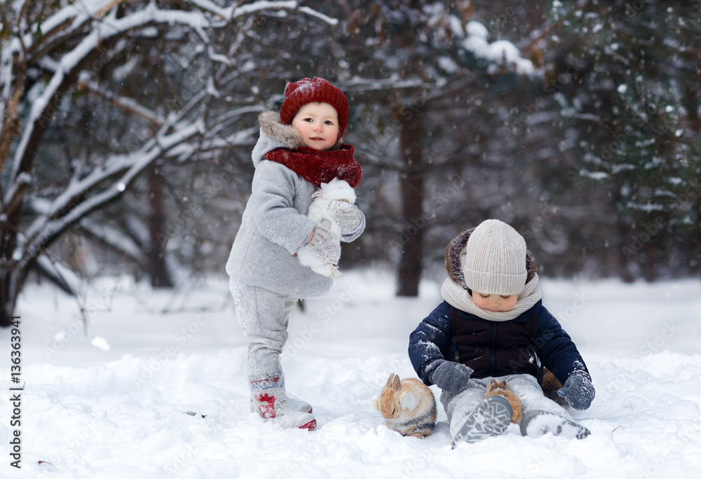 Little children with rabbit