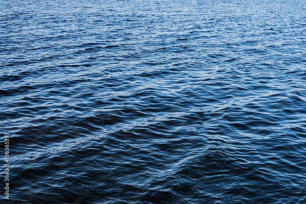 Fototapeta premium deep blue rippled water surface background