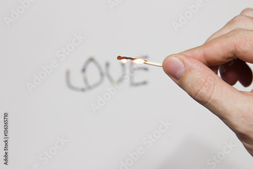 Fototapeta Naklejka Na Ścianę i Meble -  The inscription of burning matches: love.