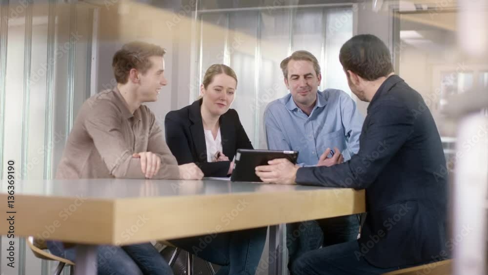 Businessgroup discusses a new project in office on a tablet
Businessgroup discusses a new project in office on a tablet