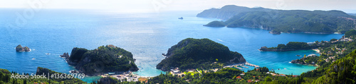 Beautiful summer panoramic seascape. View of the coastline into the sea bays with crystal clear azure water. In the backlight sunbeam light. Paleokastrica. Corfu. Ionian archipelago. Greece. © Sodel Vladyslav