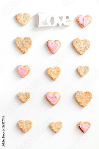 cookies for Valentine Day heartshaped white background top view pattern