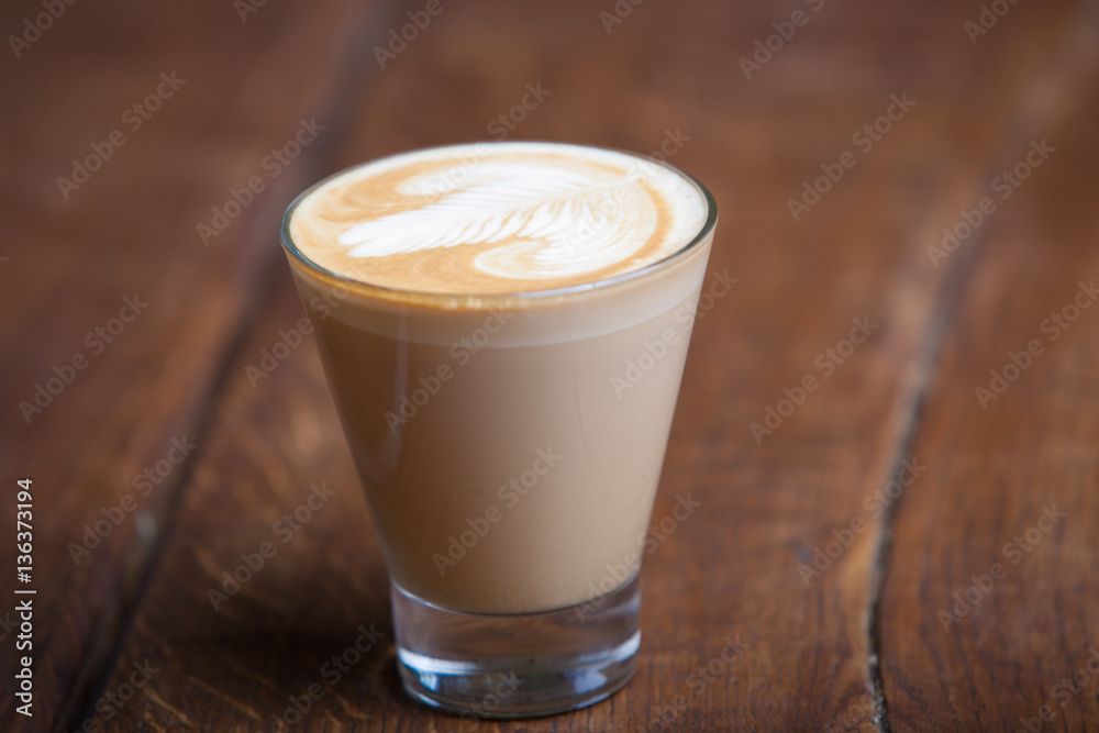 cappuccino in a glass on a wooden background cappuccino in a glass on a wooden background