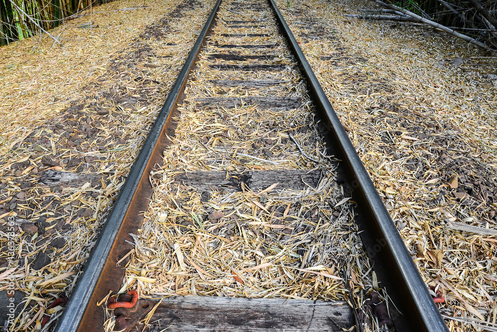 Fototapeta premium Old train track made of steel, wood and stones.