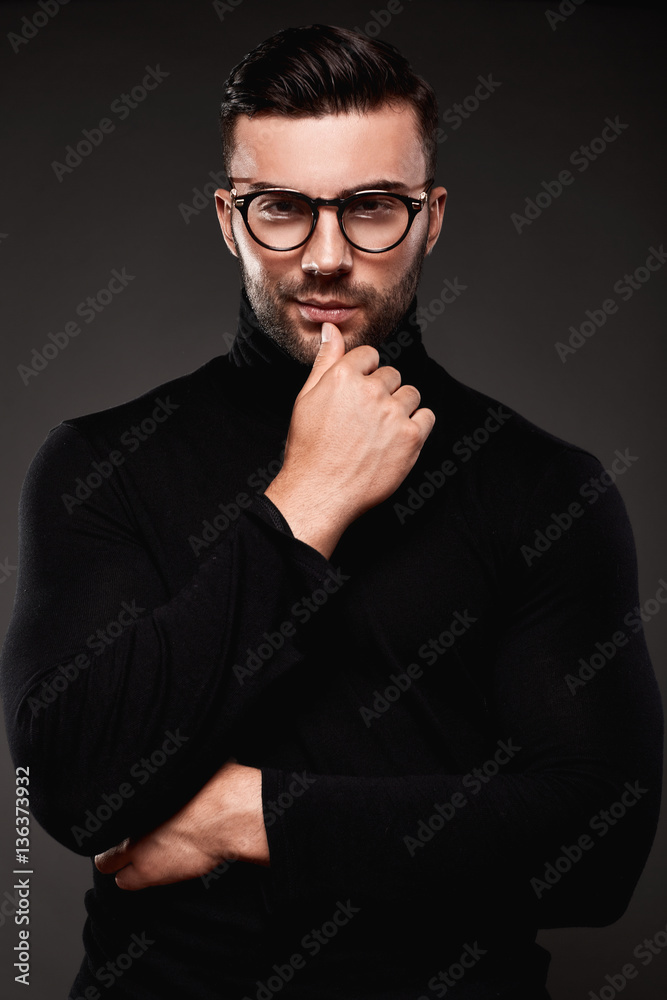 Fototapeta premium Serious thoughtful handsome man in golf and glasses