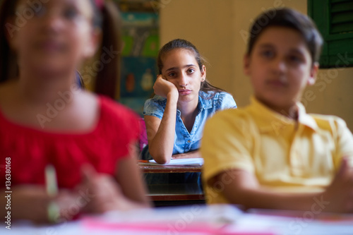 Canvas Print Bored Female Student Latina Girl In Class At School