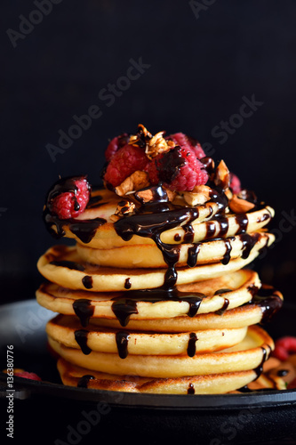 Homemade Pancake with raspberries, almonds and chocolate.