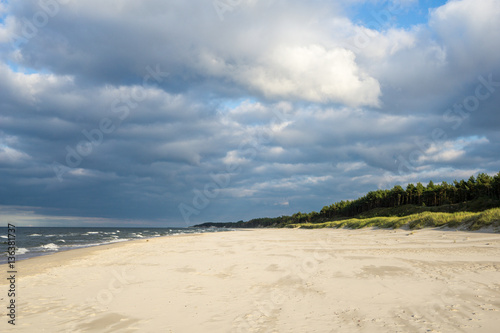 beach by the sea on a cloudy day