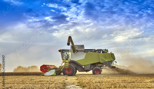 фотографія Combine harvesting on the South Downs in Sussex, UK