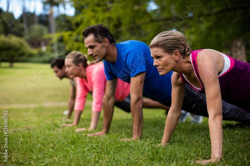 Group of people performing stretching exercise