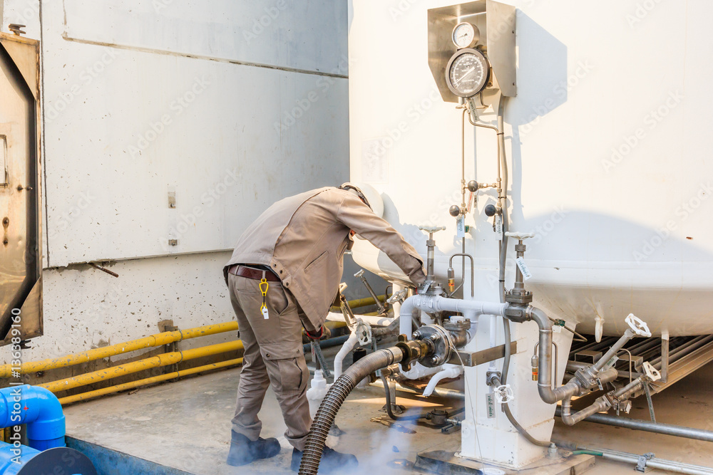 Technician fill with liquid nitrogen with Nitrogen storage tank at new factory Technician fill with liquid nitrogen with Nitrogen storage tank at new factory