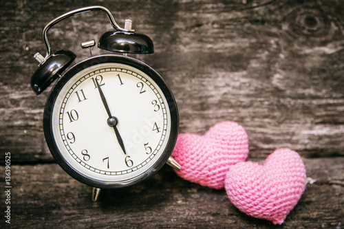 Love clock at 6 o'clock, Time of sweet loving pass memories story on the old wood background. photo