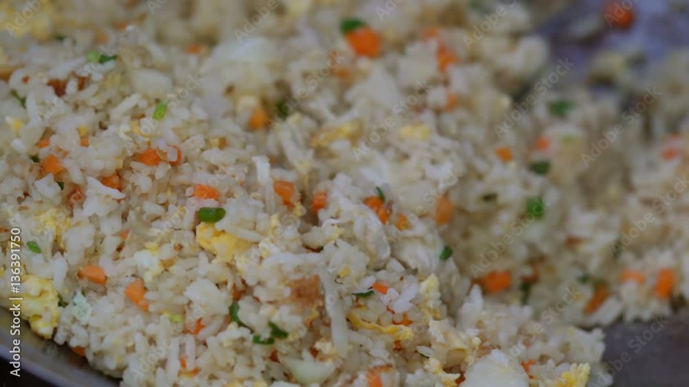 Cooking fried rice in a pan
Cooking fried rice in a pan