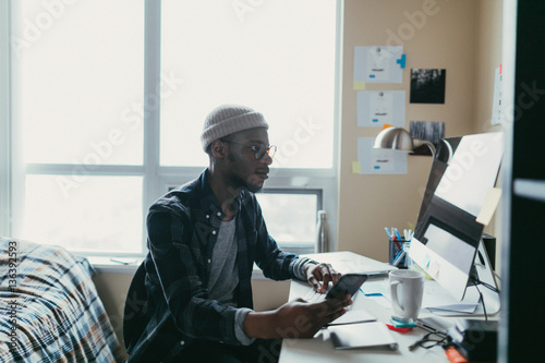 African american man working in his bedroom office