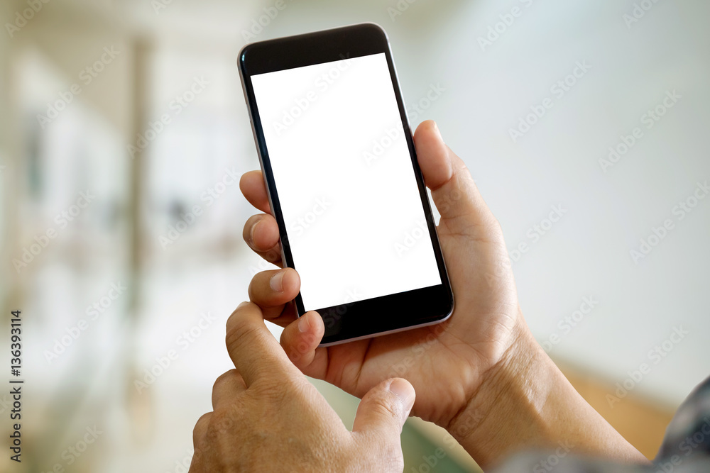 Man using Smartphone with curtain background