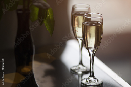 two glasses with champagne in cafe photo