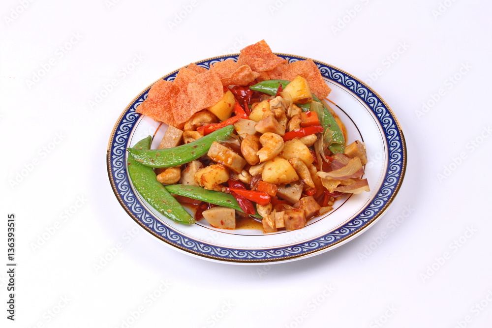 Fried mixed fruit and vegetable with roasted chili plate .