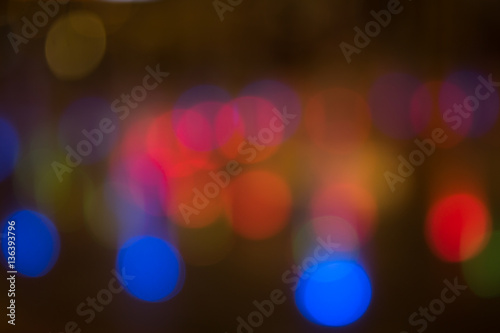 bokeh of water fly and lights on black red blue dot background