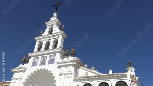 4K The Hermitage of El Rocío. The Church is home to the Virgin of El Rocío in the countryside of Almonte, Province of Huelva, Andalusia, Spain-Dan photo