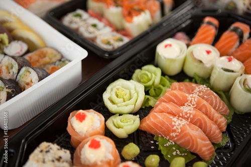 Assorted sushi set served in plastic boxes