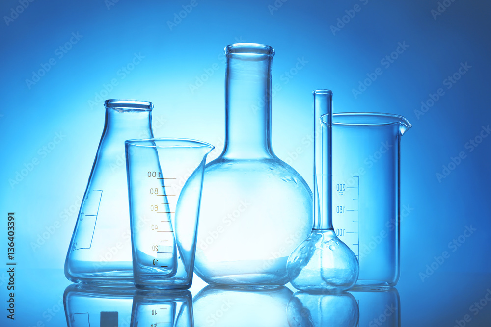 Test beakers and flasks on color background Test beakers and flasks on color background
