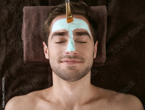 Man having cosmetic mask in...