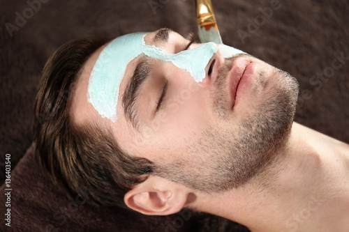 Man having cosmetic mask in...