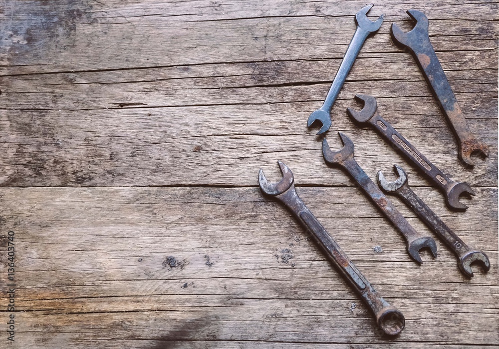 hammer and wrench with wood background hammer and wrench with wood background