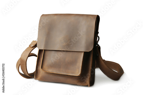 Brown leather bag on white ...