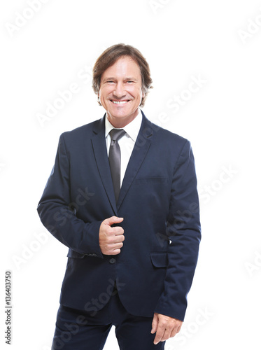 Confident man in suit on wh...