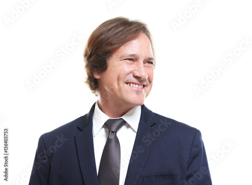 Confident man in suit on wh...