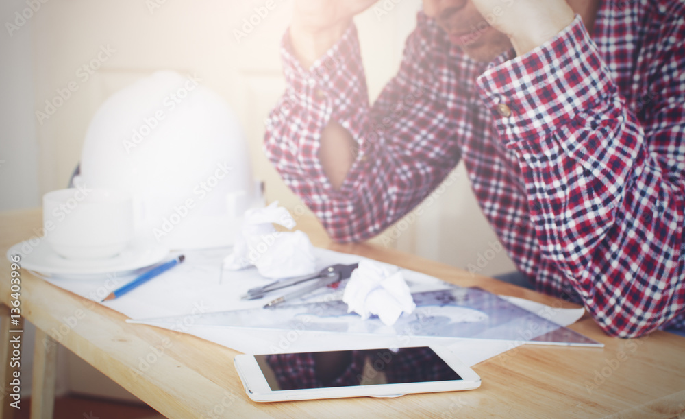 Man drawing his blue print, thinking seriously with work and try to find solution to resolve problem, with cross processing on instagram like. Man drawing his blue print, thinking seriously with work and try to find solution to resolve problem, with cross processing on instagram like.