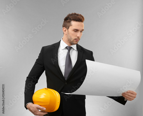 Handsome engineer with draw...