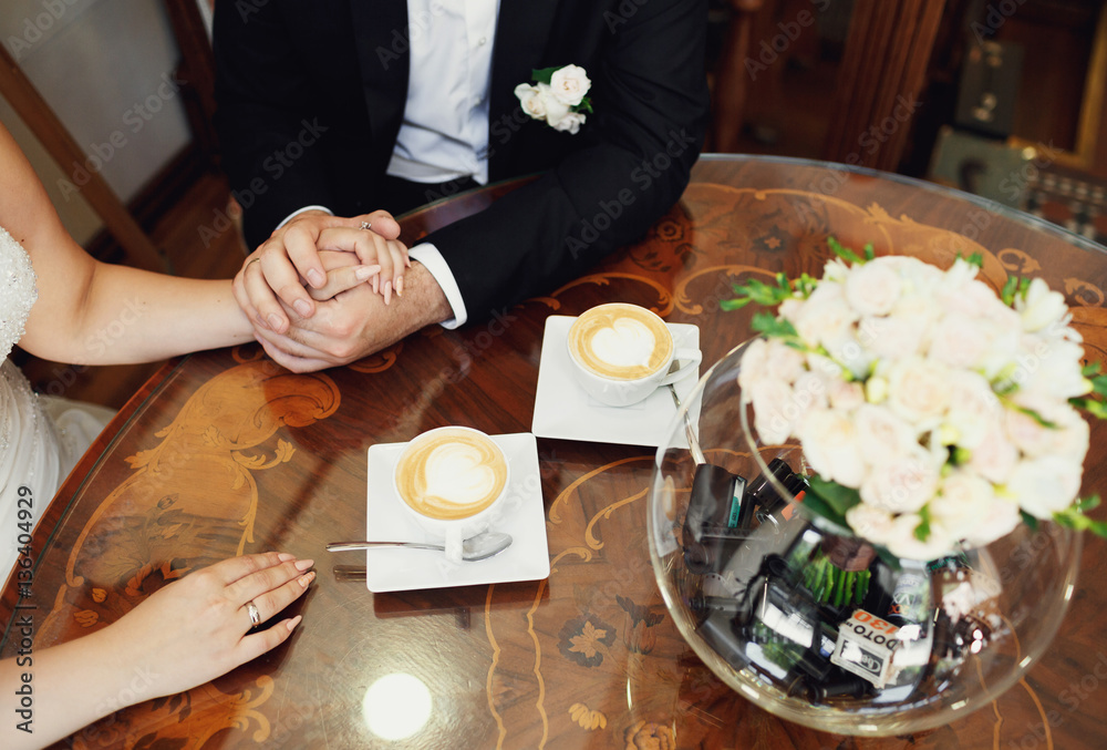 Cappuccino and wedding couple in the cafe